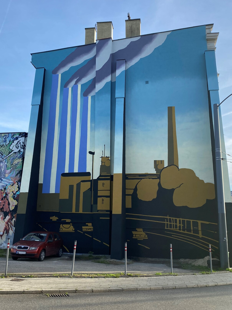 obraz widoku kominów górujących nad byłą Hutą Kościuszko